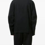 Black jackets worn by a person, showing the jackets fit