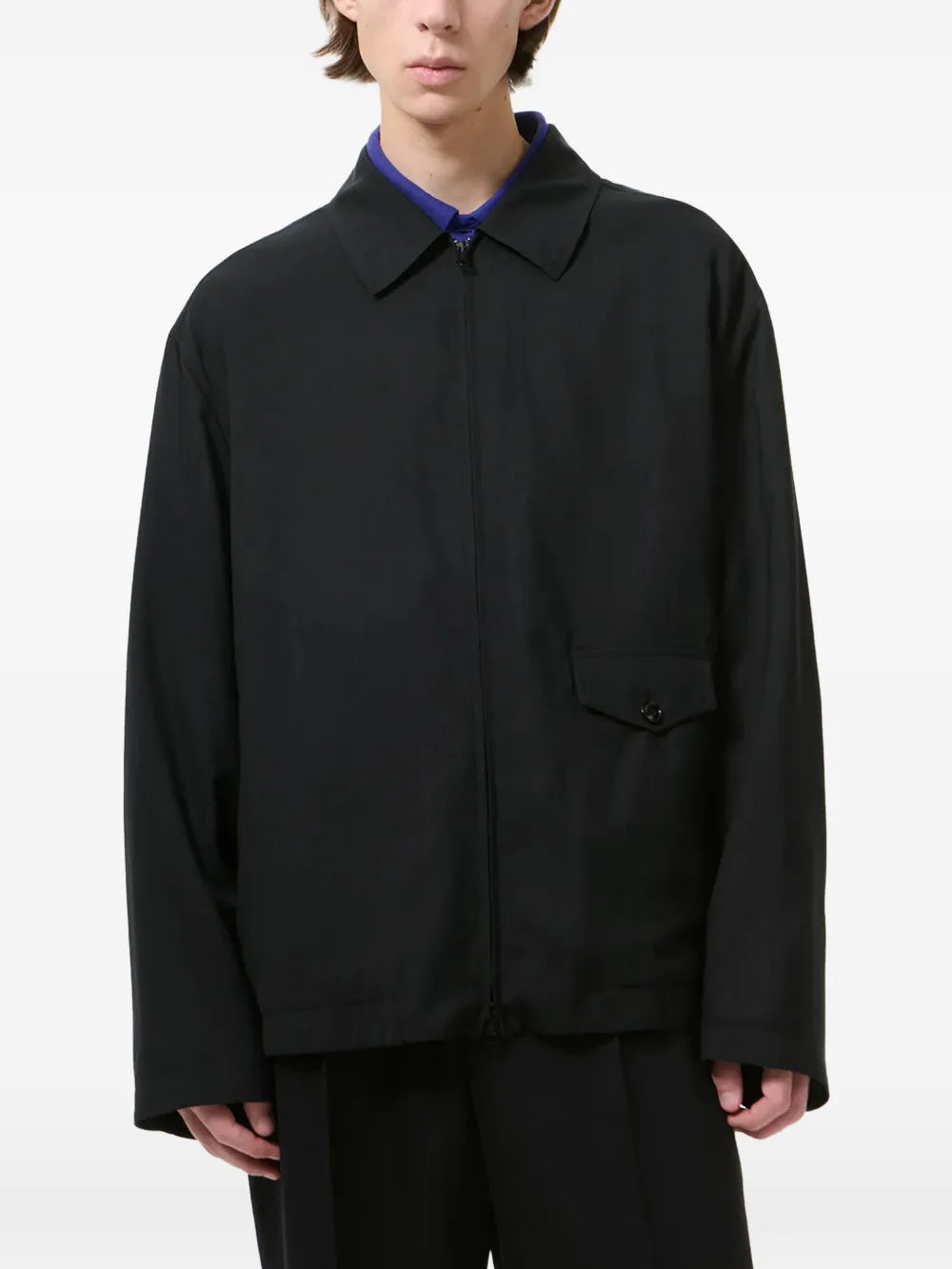 Black jackets worn by a person, showing the jackets fit