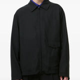Black jackets worn by a person, showing the jackets fit
