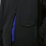 Close up of Black jacket, showing texture of the super merino wool fabric
