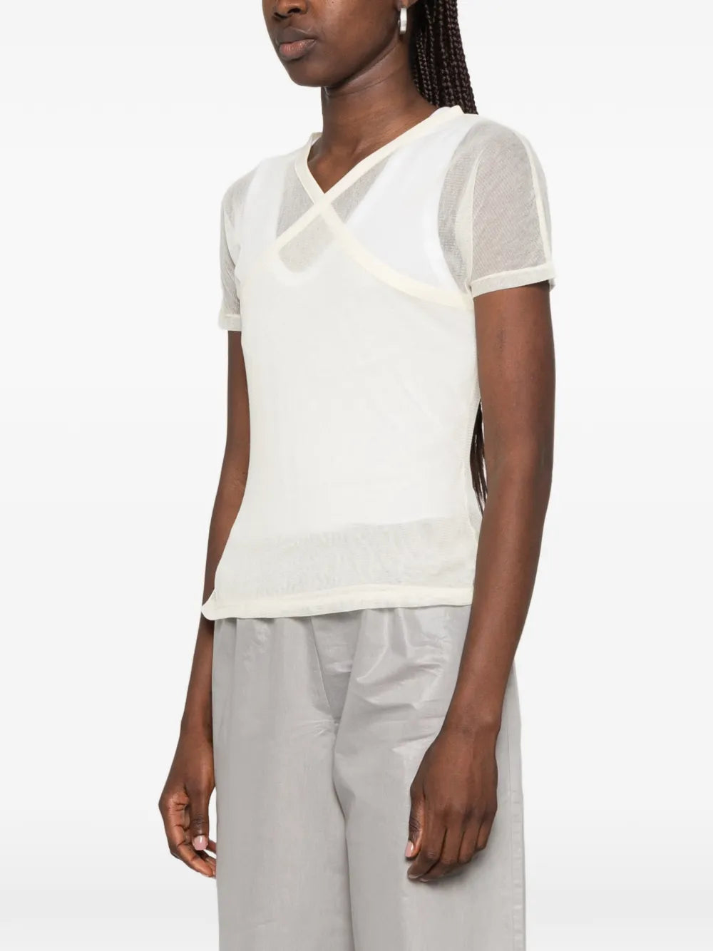 Tan top worn by a person, showing the top fit