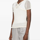 Tan top worn by a person, showing the top fit