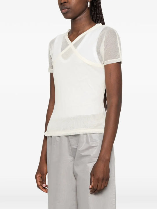 Tan top worn by a person, showing the top fit
