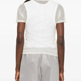 Tan top worn by a person, showing the top fit