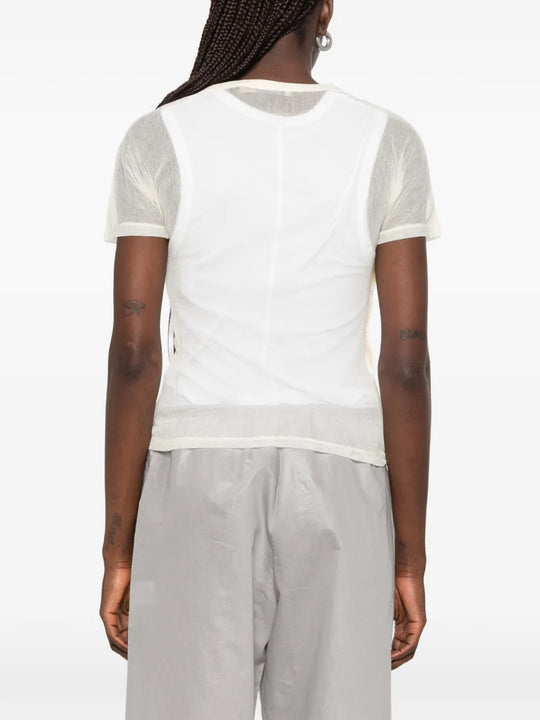 Tan top worn by a person, showing the top fit