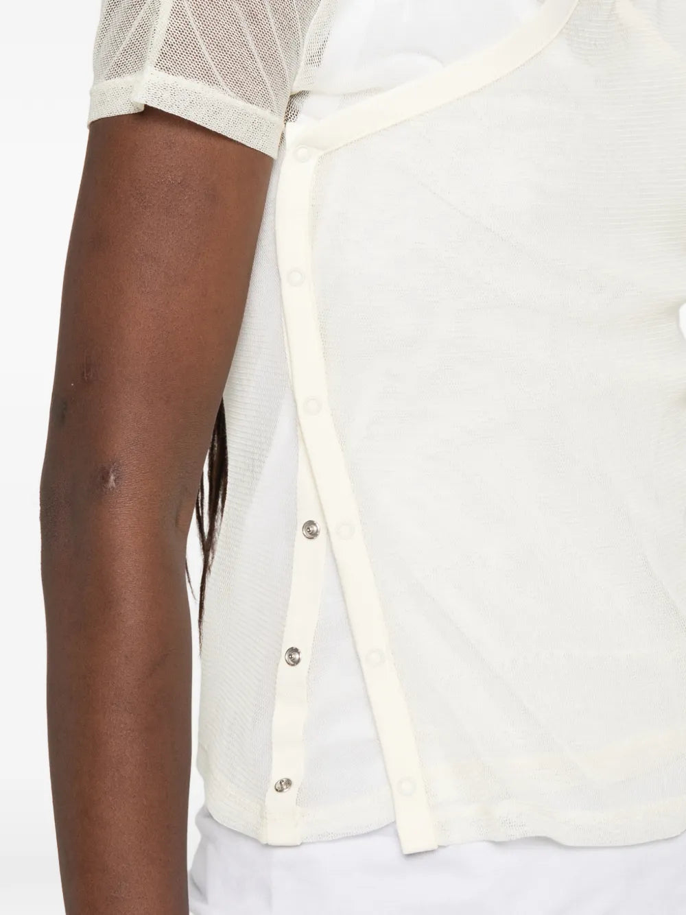 Tan top worn by a person, showing the top fit