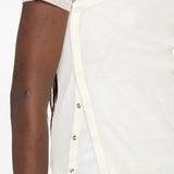 Tan top worn by a person, showing the top fit