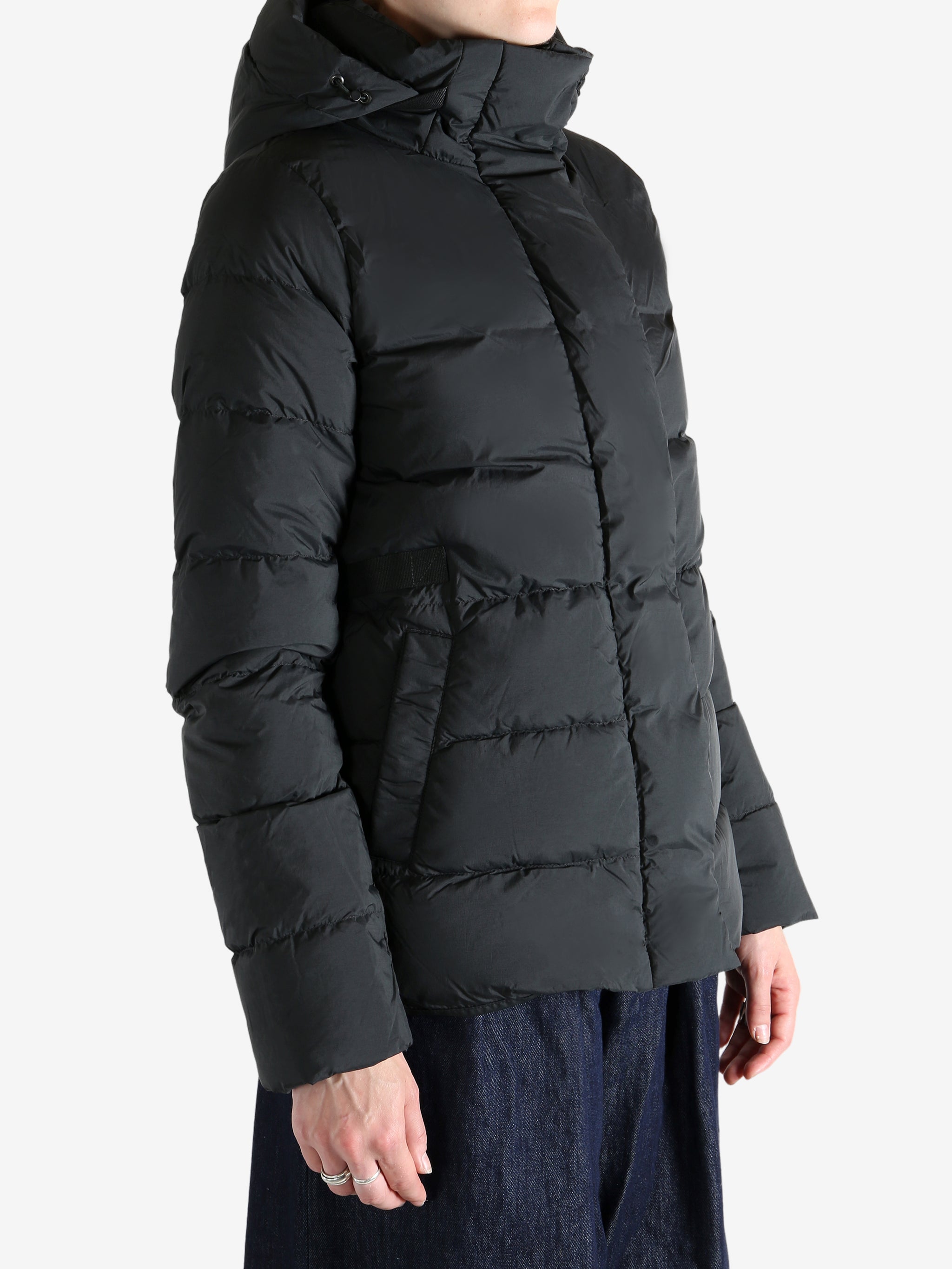 Black jacket worn by a person, showing the jacket's fit