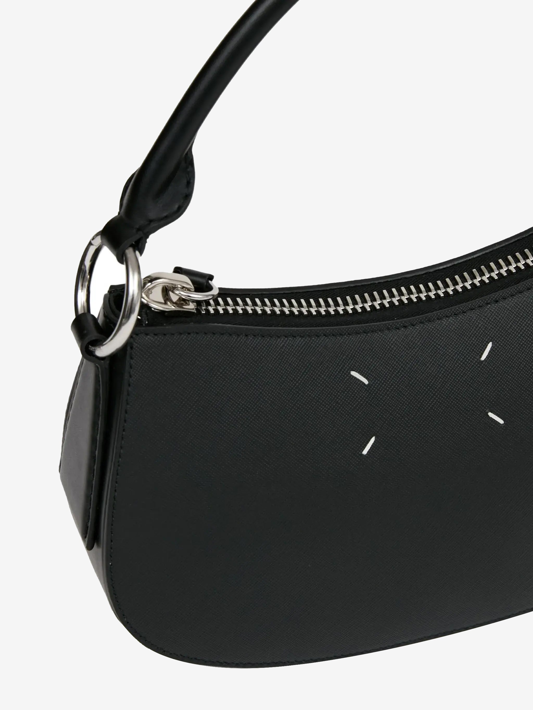 Close up of black bag, showing texture of the leather fabric