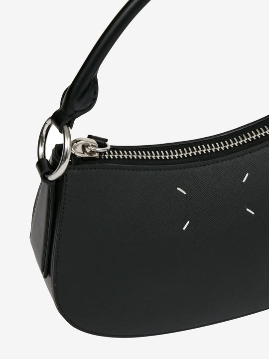 Close up of black bag, showing texture of the leather fabric