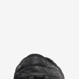 Close up of the black sneakers, showing texture of the polyester fabric