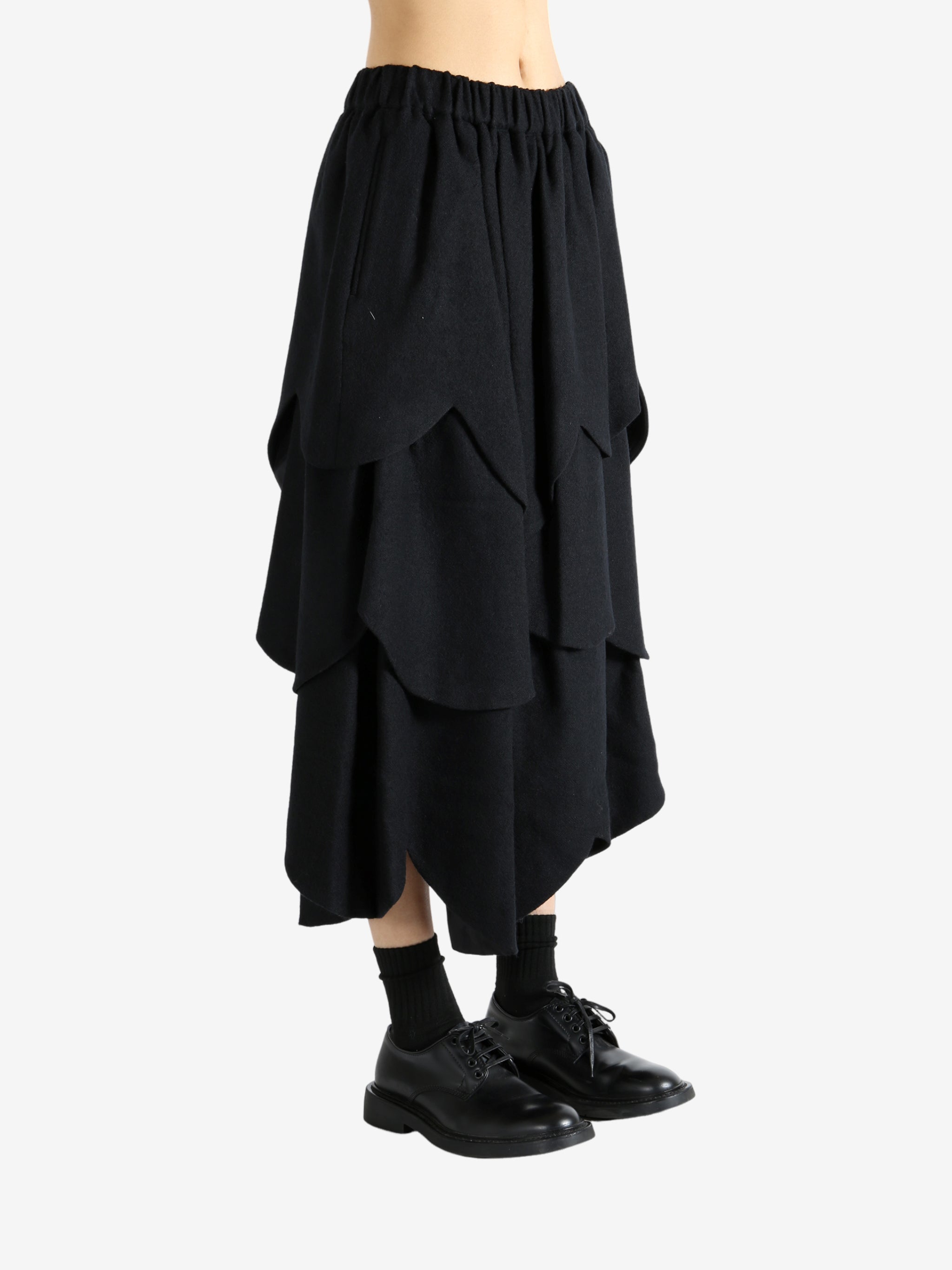 Black skirt worn by a person, showing the skirt's fit