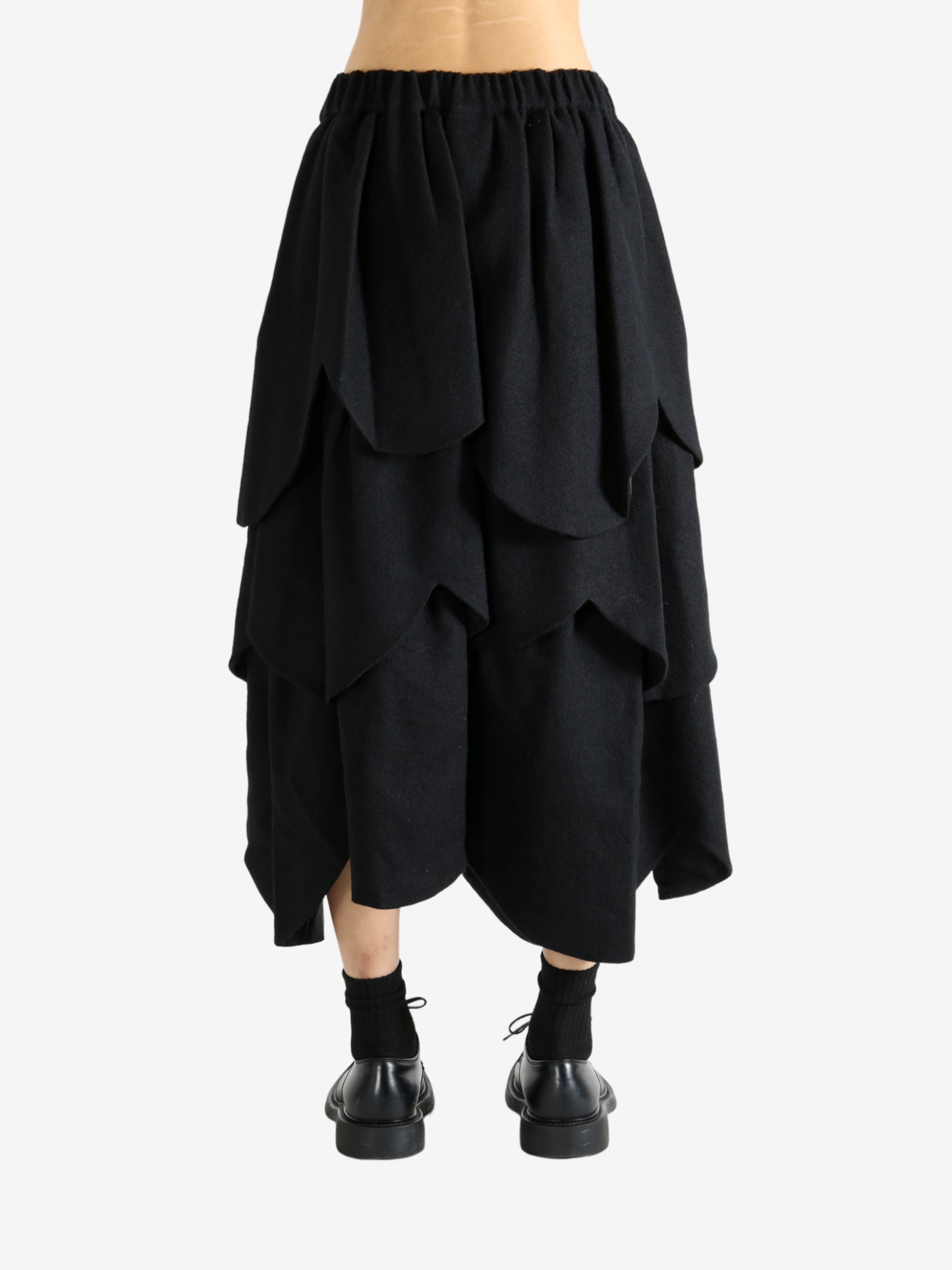 Black skirt worn by a person, showing the skirt's fit