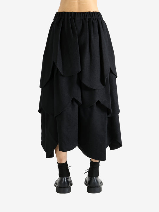 Black skirt worn by a person, showing the skirt's fit