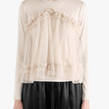 tan shirt worn by a person, showing the shirt fit