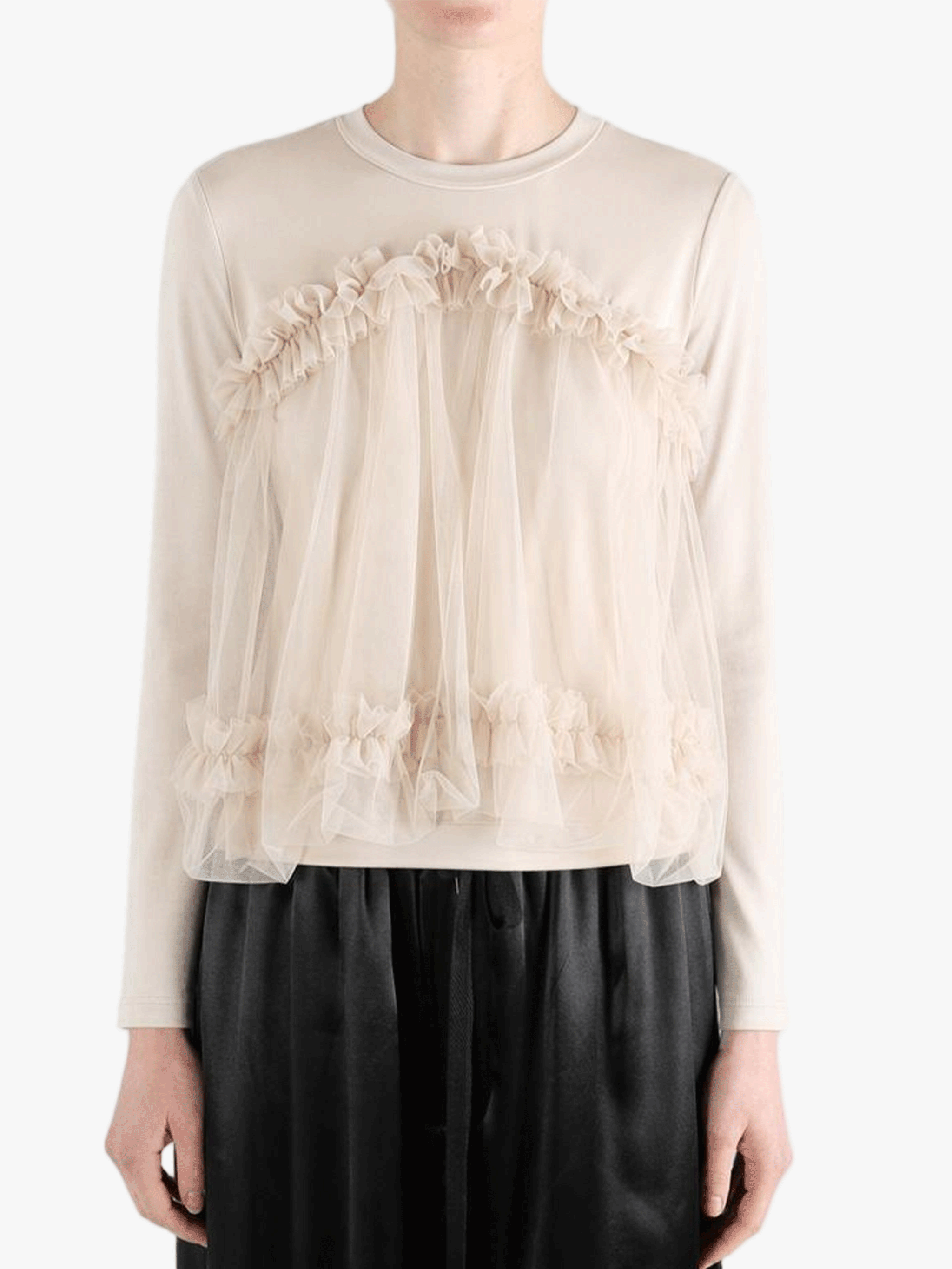 tan shirt worn by a person, showing the shirt fit