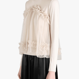tan shirt worn by a person, showing the shirt fit