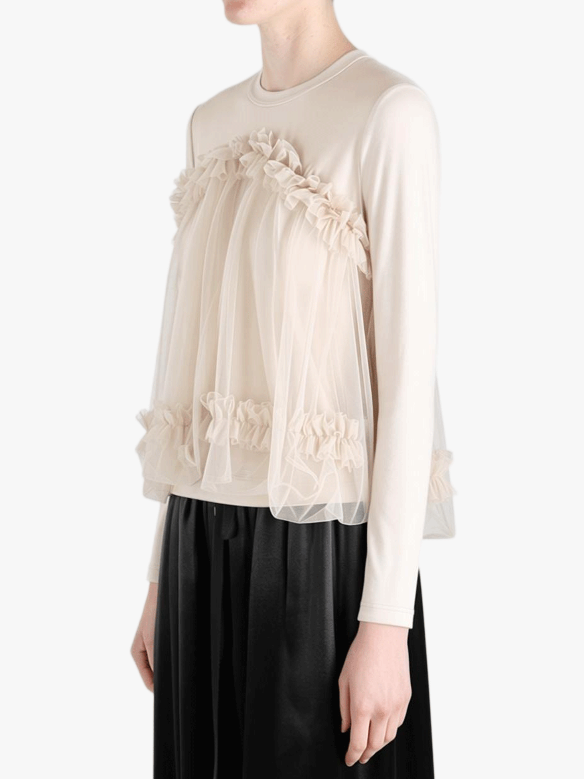 tan shirt worn by a person, showing the shirt fit
