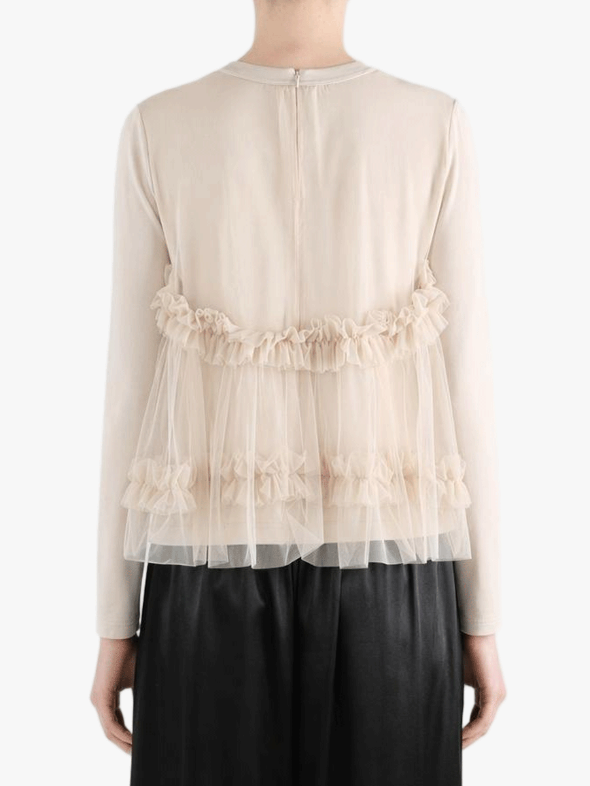 tan shirt worn by a person, showing the shirt fit