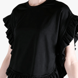 Black t-shirt worn by a person, side view