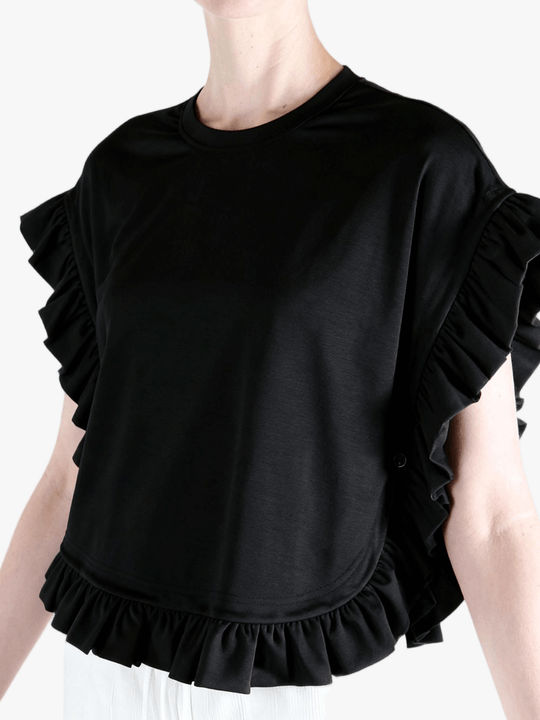 Black t-shirt worn by a person, side view