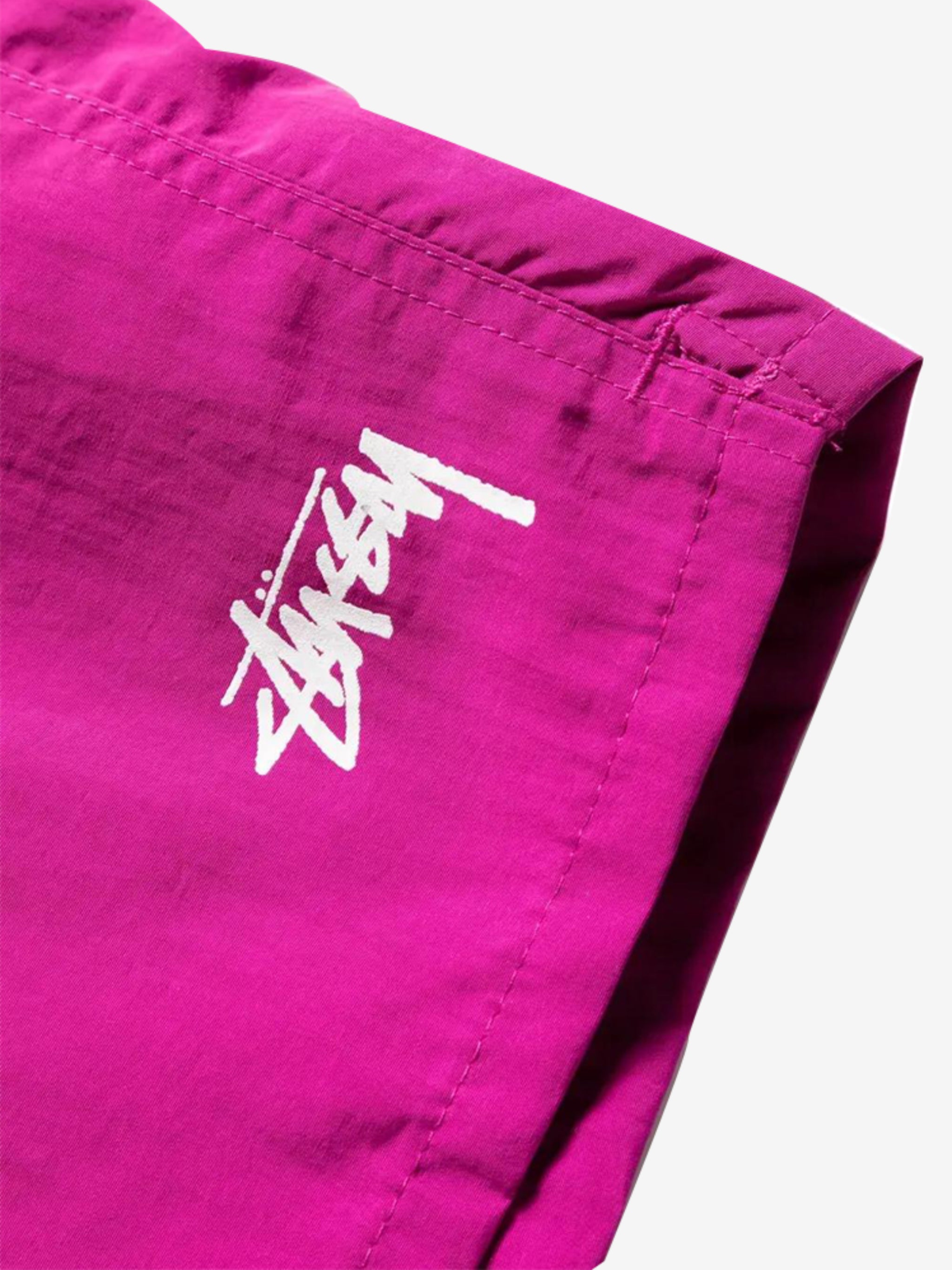 Close up of pink shorts, showing texture of the nylon fabric