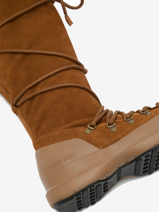 Close up of brown boots, showing texture of bovine Leather and goat skin fabric