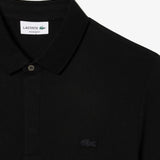 Close up of the black shirt, showing texture of the cotton fabric