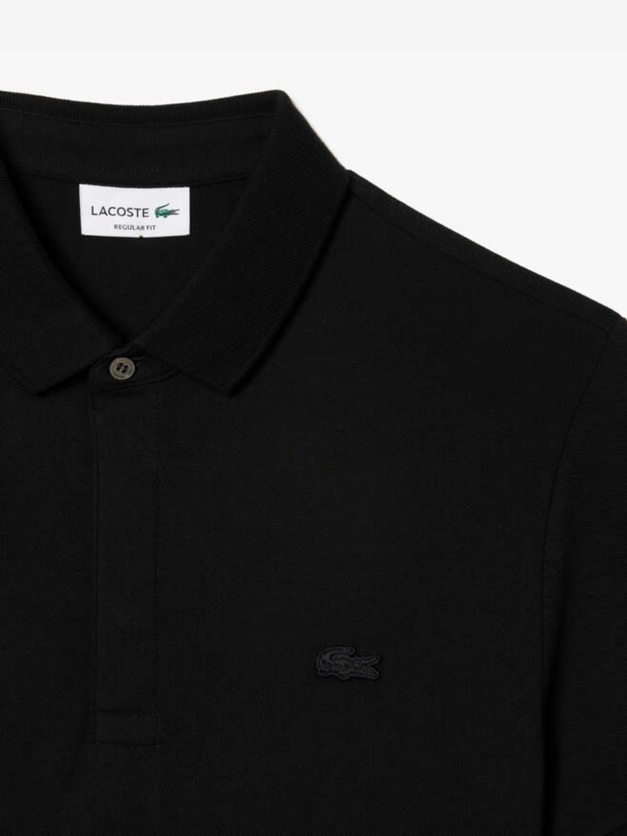 Close up of the black shirt, showing texture of the cotton fabric