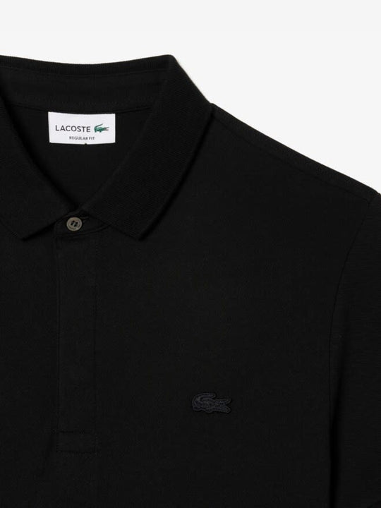 Close up of the black shirt, showing texture of the cotton fabric