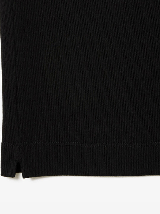Close up of the black shirt, showing texture of the cotton fabric