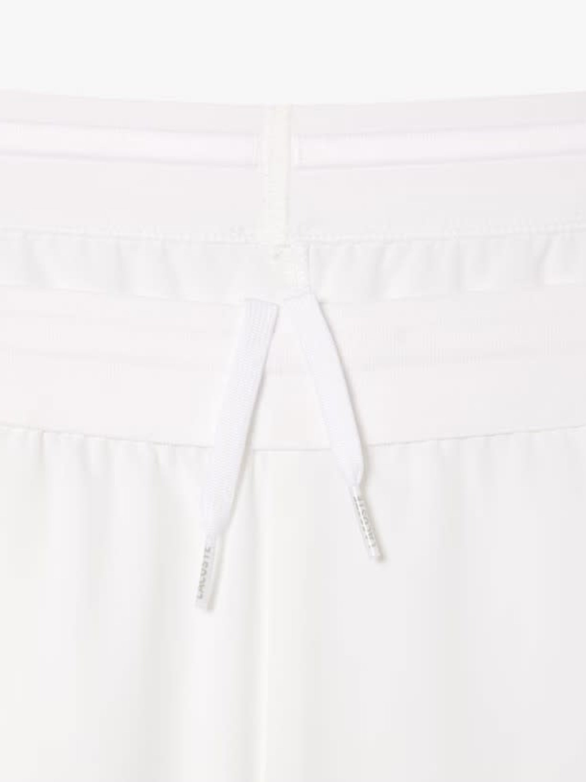 Close up of white shorts,showing texture of the cotton fabric.