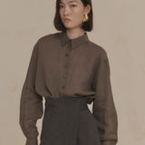 Purple shirt worn by a person, showing the shirt’s fit