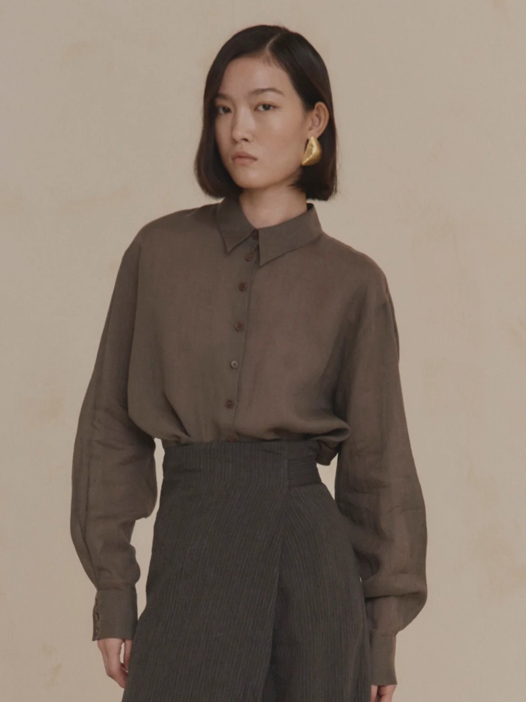 Purple shirt worn by a person, showing the shirt’s fit