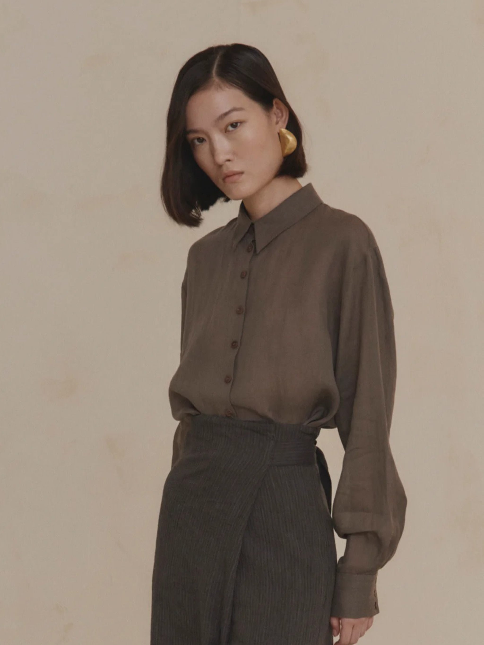 Purple shirt worn by a person, showing the shirt’s fit