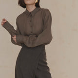 Purple shirt worn by a person, showing the shirt’s fit