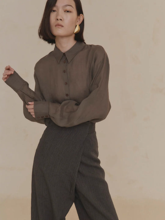 Purple shirt worn by a person, showing the shirt’s fit