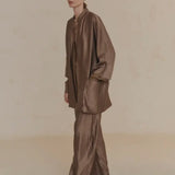 Tan pant worn by a person, showing the pant's fit