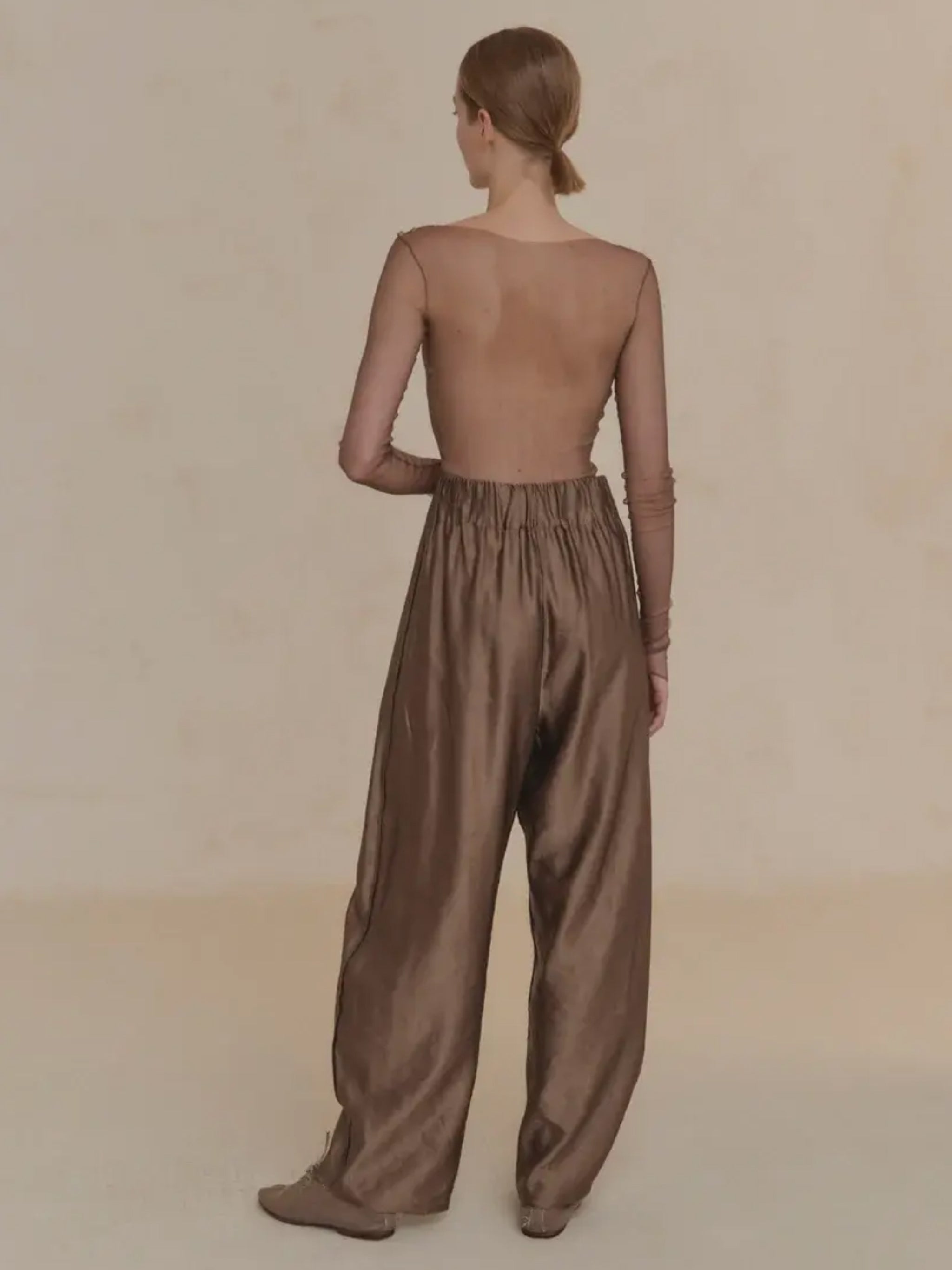 Tan pant worn by a person, showing the pant's fit