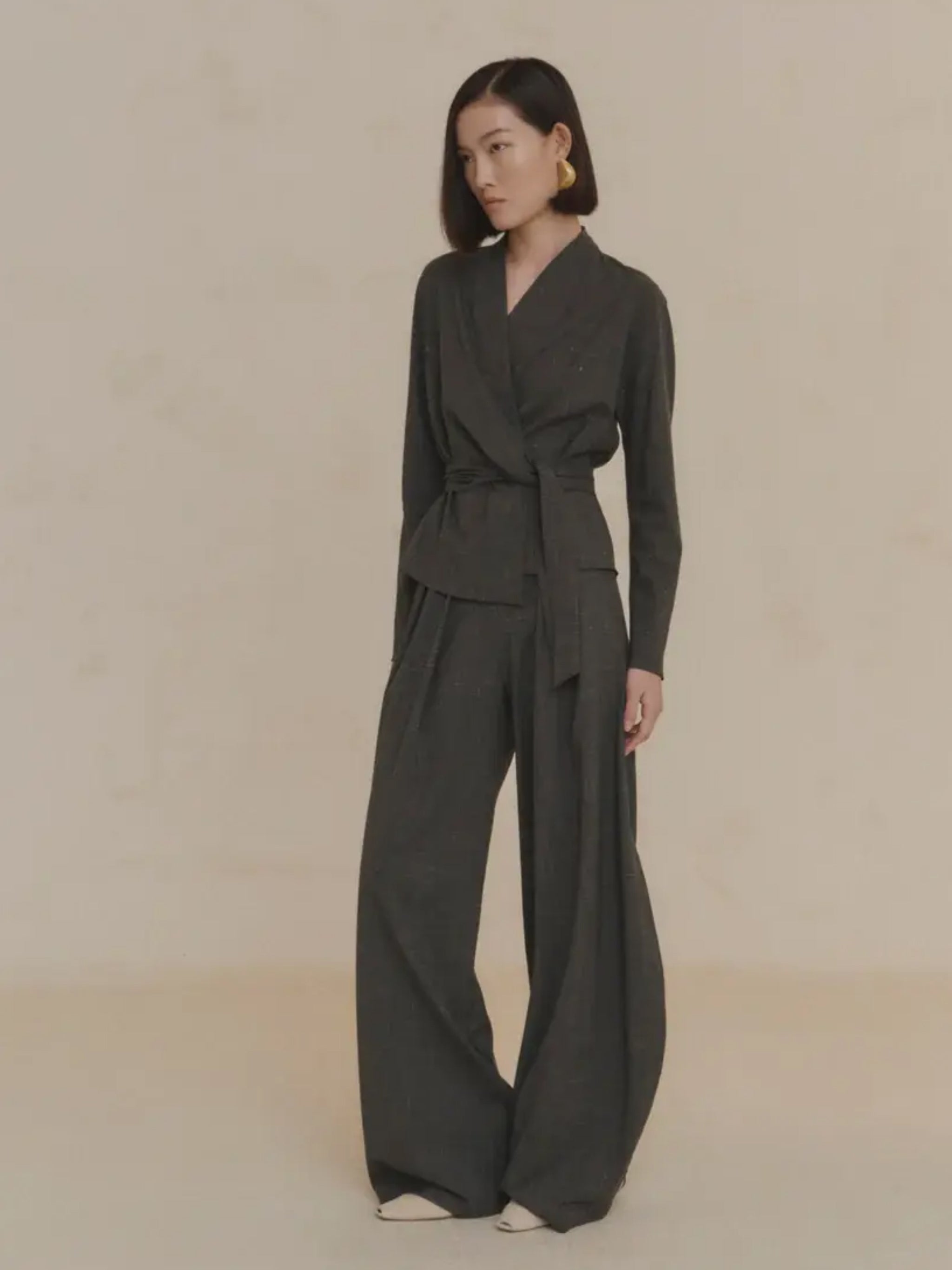 Green jacket worn by a person, showing the jacket's fit