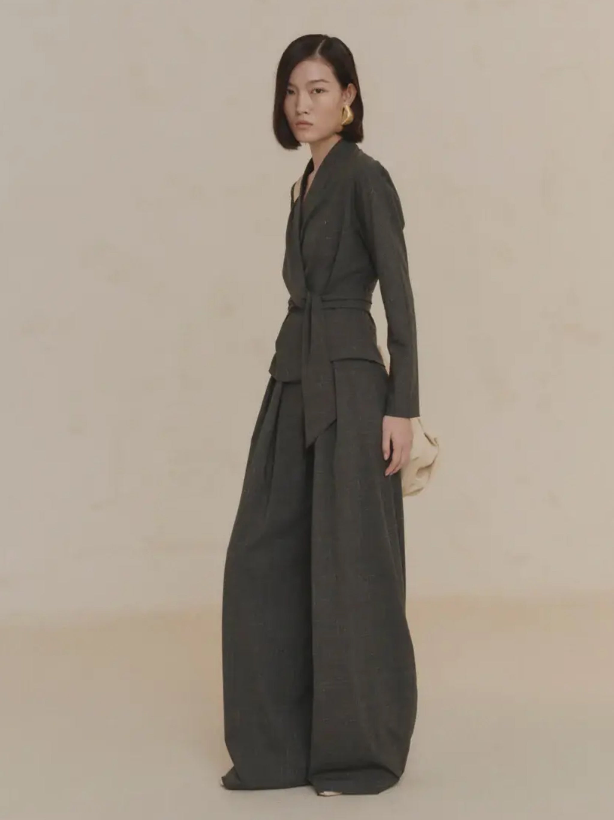 Green jacket worn by a person, showing the jacket's fit