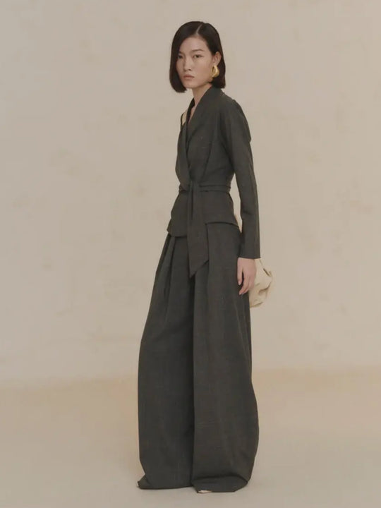 Green jacket worn by a person, showing the jacket's fit