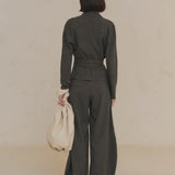 Green jacket worn by a person, showing the jacket's fit