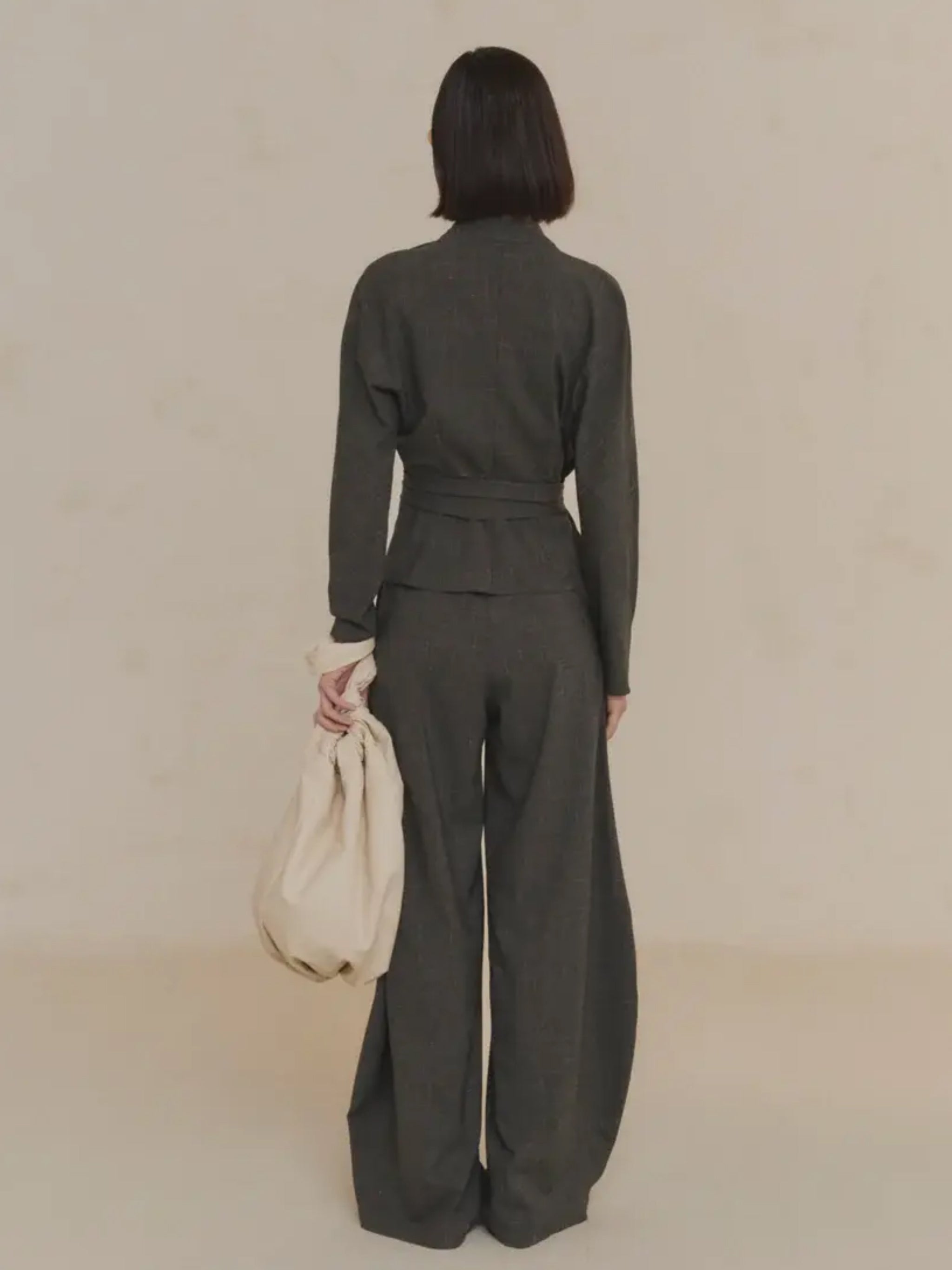 Green jacket worn by a person, showing the jacket's fit