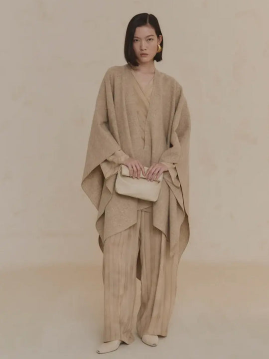 Tan coat worn by a person, showing the coat's fit