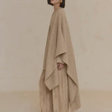 Tan coat worn by a person, showing the coat's fit