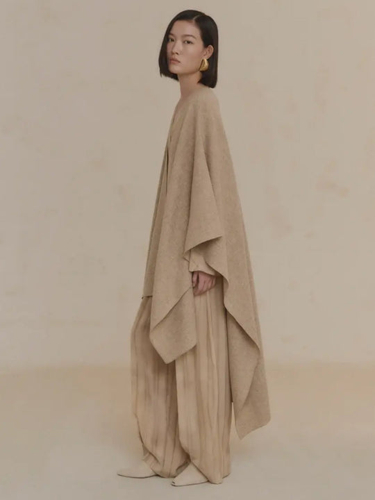 Tan coat worn by a person, showing the coat's fit