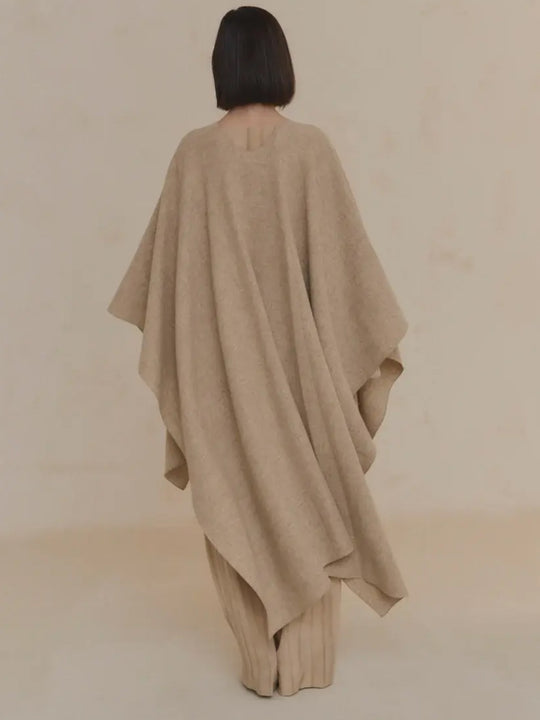 Tan coat worn by a person, showing the coat's fit