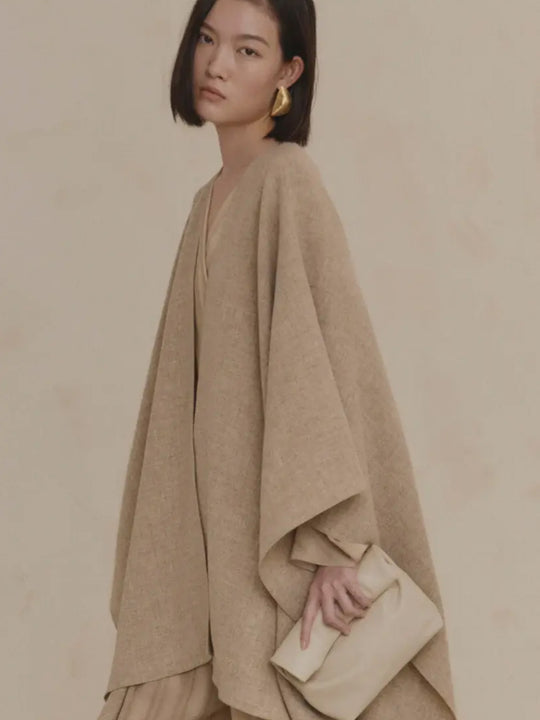 Close up of tan coat, showing texture of the wool fabric