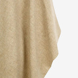 Close up of tan coat, showing texture of the wool fabric